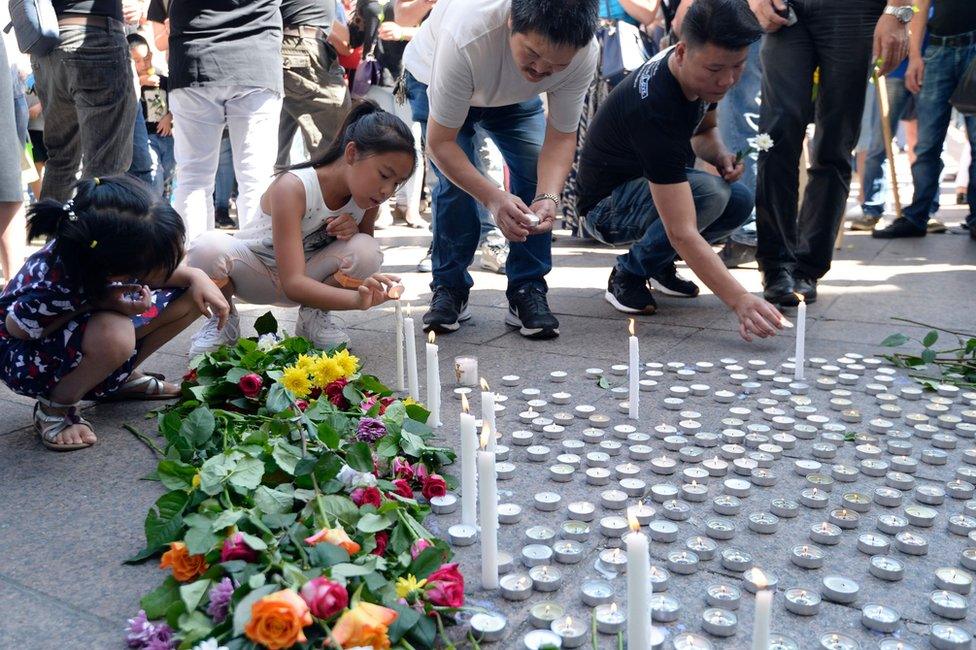 Tributes outside the town hall in Aubervilliers, north-eastern suburbs of Paris, 14 August