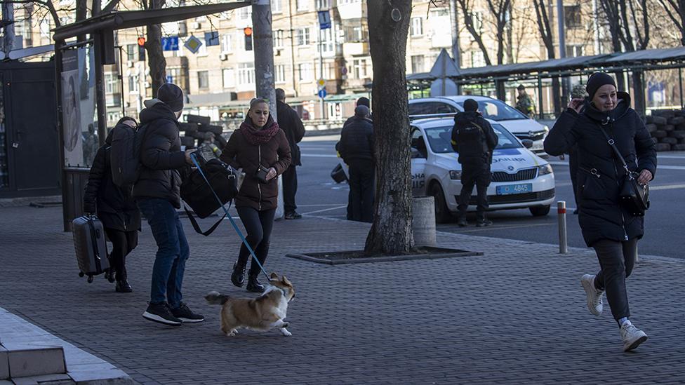 People leave the Zhuliany neighbourhood in Kyiv t on February 26, 2022