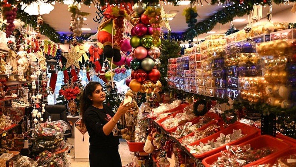 woman buys Christmas decorations