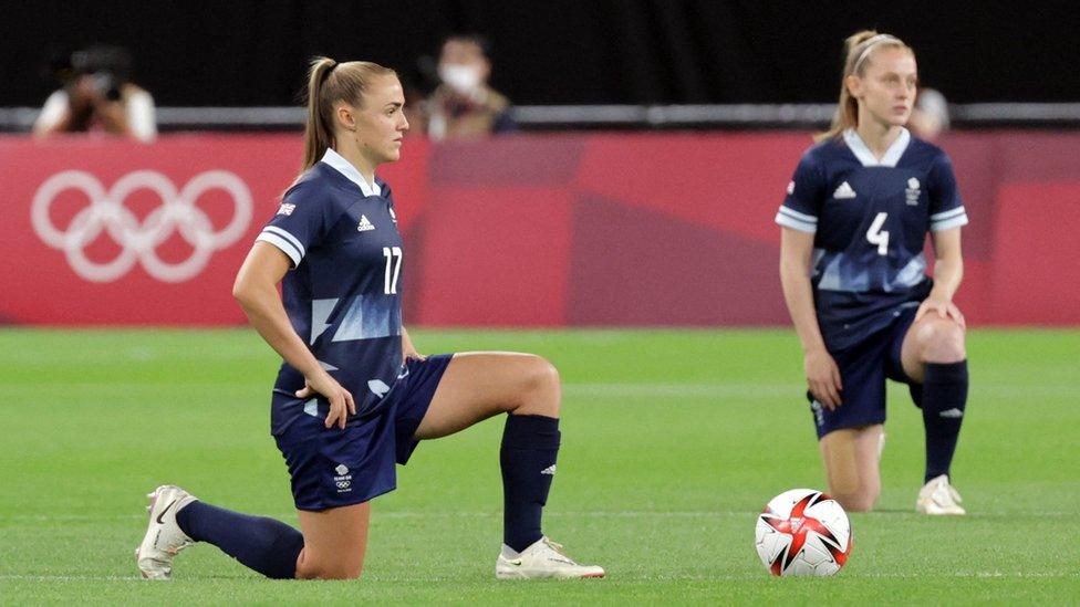 Women's football players for team GB take the knee