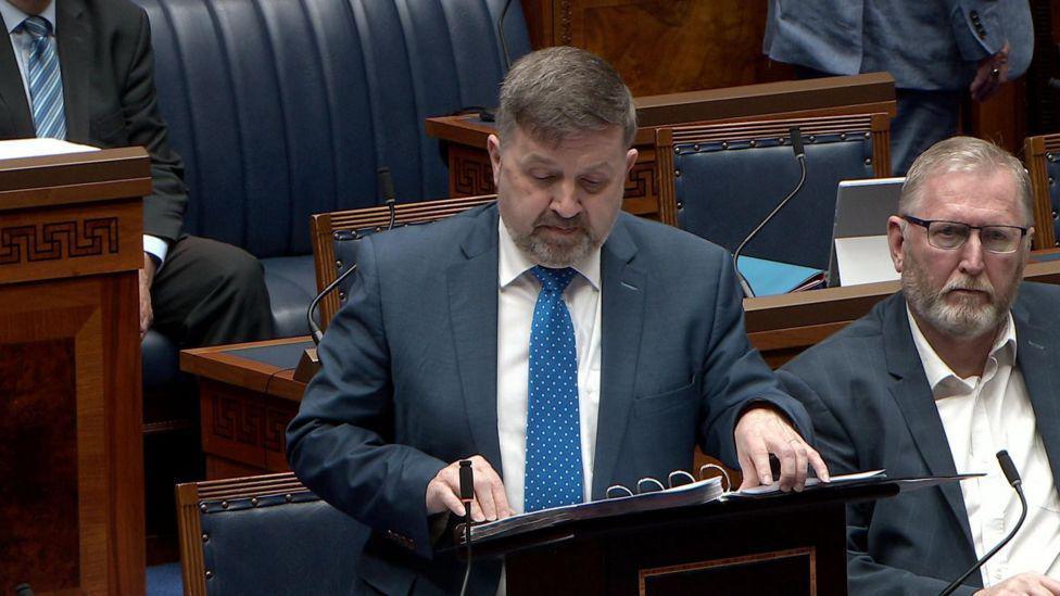 Health Minister Robin Swann speaking in the Northern Ireland Assembly