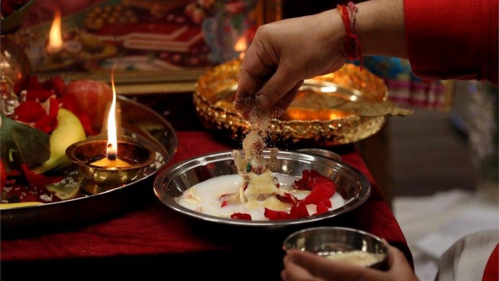 Priests Pandit Nayan Vyas and Pandit Bal Krishan Gautama perform a live stream Diwali Puja service from the Hindu Temple in Newcastle, Britain, November 14, 2020