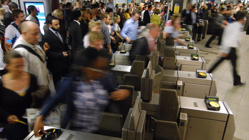 Oyster cards being used at a ticket gate in 2008