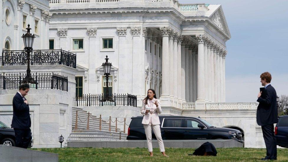 Democratic US Representatives practise social distancing as they discuss the stimulus bill