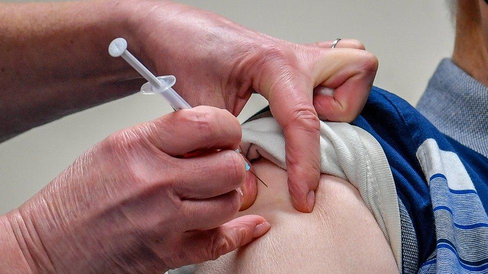 A patient receives the Astra Zeneca/Oxford University Covid-19 vaccine in Merthyr Tydfil