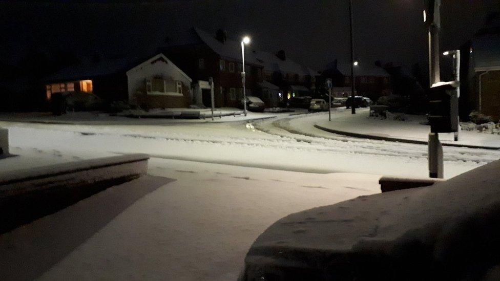 A snow-covered residential street in Leicester