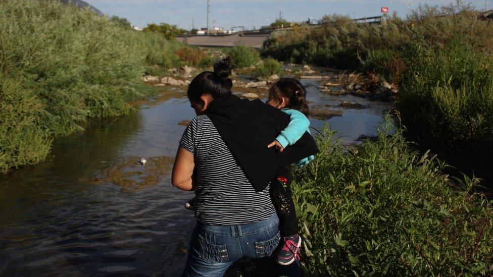 A woman on 19 May 2019 crosses the Rio Bravo, Mexico