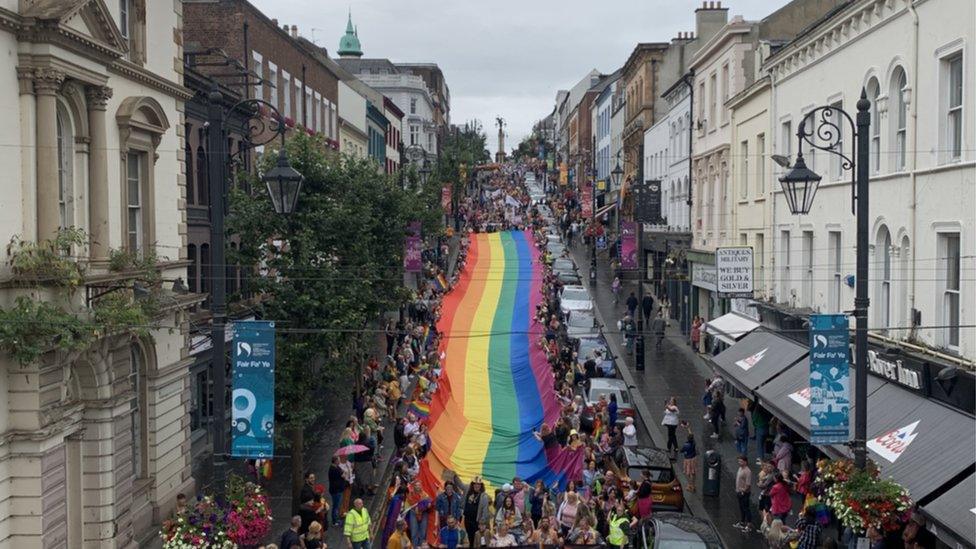 Giant flag being carried during parade