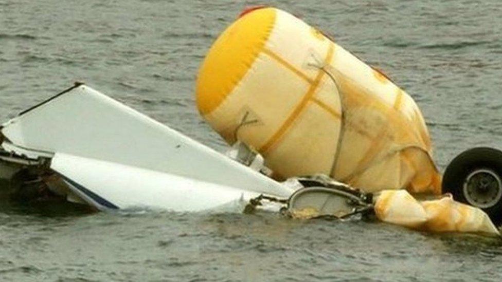 Helicopter wreckage being salvaged