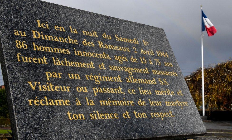 A commemorative plaque is pictured on November 13, 2017 in Villeneuve-d'Ascq, northern France, reminding of the April 2, 1944 WWII massacre of 86 civilians