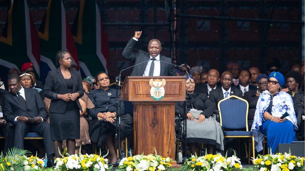 South African Vice President David Mabuza gestures at the Orlando Stadium in Soweto, Johannesburg, on April 11, 2018 during a memorial service for late South African anti-apartheid campaigner Winnie Madikizela-Mandela.