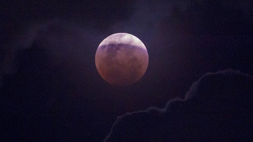 The moon is seen during a lunar eclipse referred to as the super blue blood moon, in Jakarta on 31 January 2018.