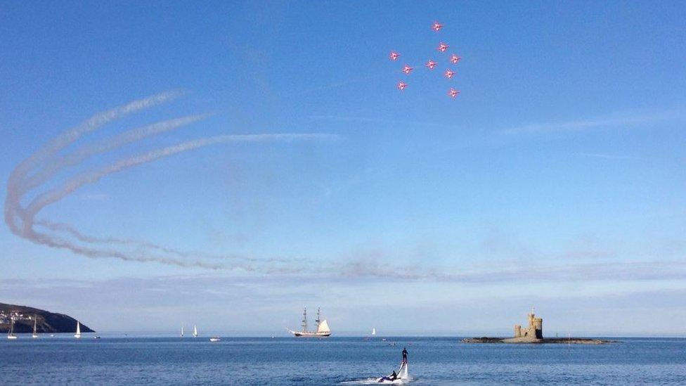 Red arrows over Douglas bay