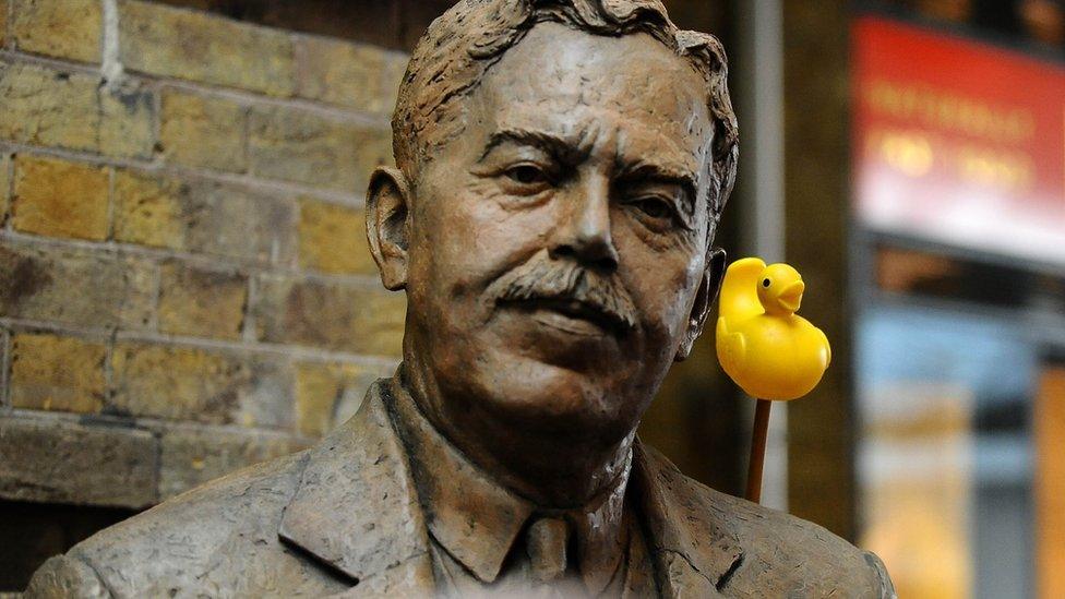 A rubber duck behind the shoulder of Sir Nigel Gresley's statue