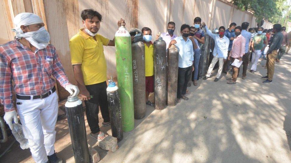 Queue of people outside oxygen supplier