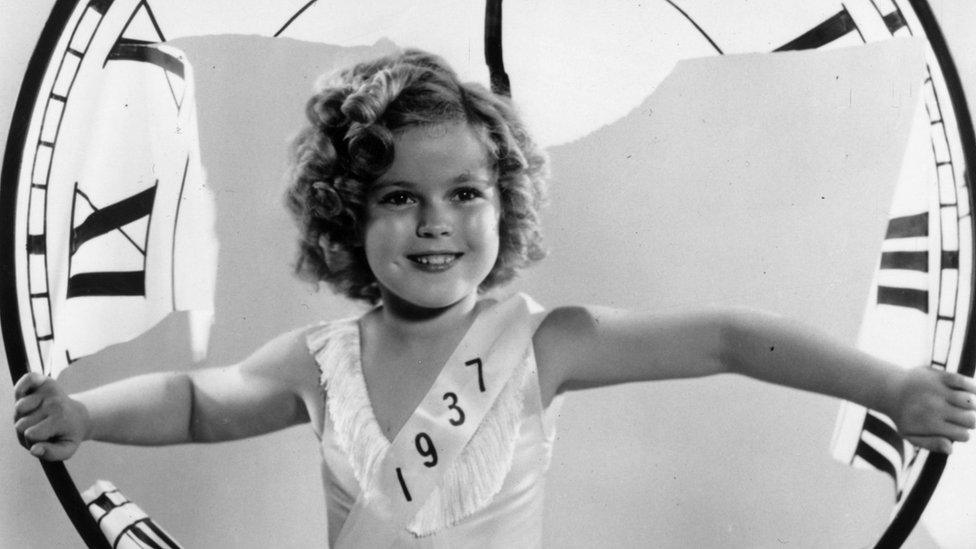 26th December 1936: American child star Shirley Temple celebrating the arrival of a new yea