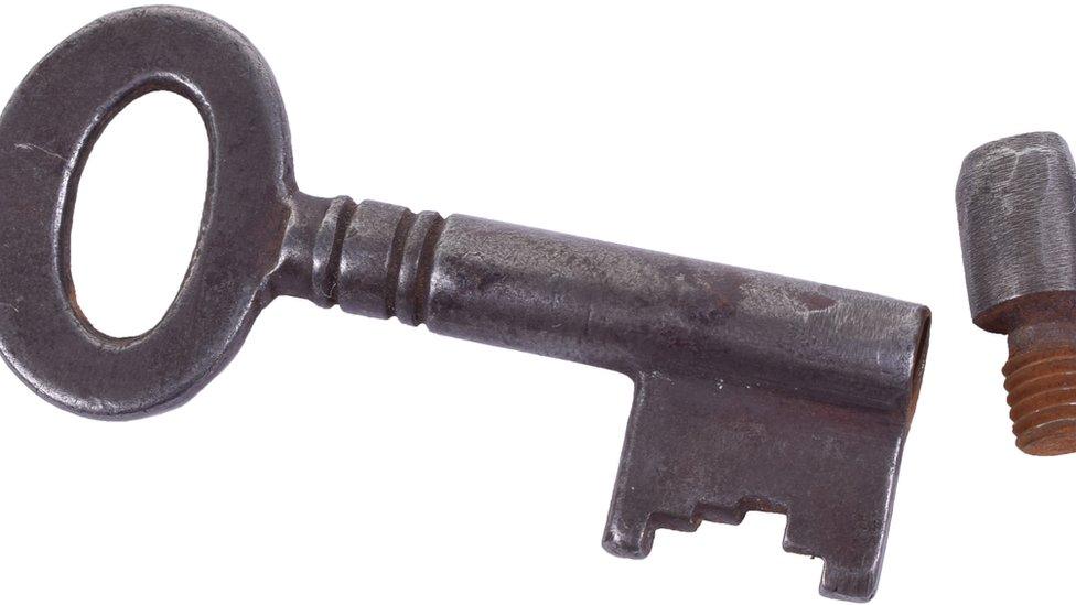 Key with a secret compartment