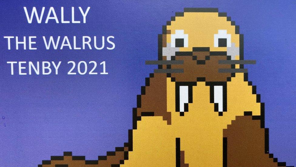 A postcard featuring Wally the Walrus