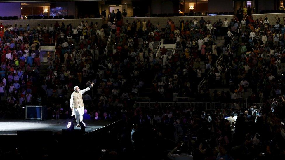 Indian Prime Minister Narendra Modi waves to the crowd after speaking at a community reception at SAP Center in San Jose