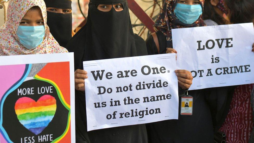 Activists belonging to various human and civil rights organisations hold placards during a demonstration condemning the decision of various Bharatiya Janata Party (BJP) led state governments in the country for the proposed passing of laws against "Love Jihad" in Bangalore on December 1, 2020.