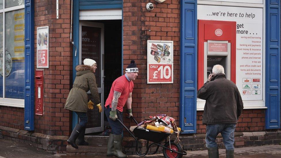 Clean-up at flooded Carlisle shop