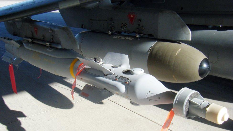 A Paveway IV laser guided bomb is pictured beneath a Harrier GR9