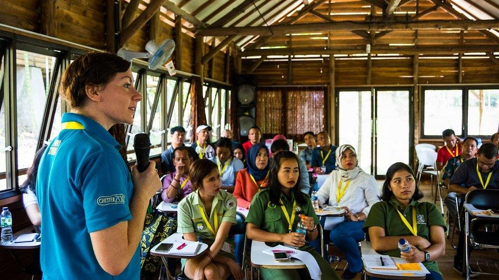 Worker from Chester Zoo teaching people in classroom