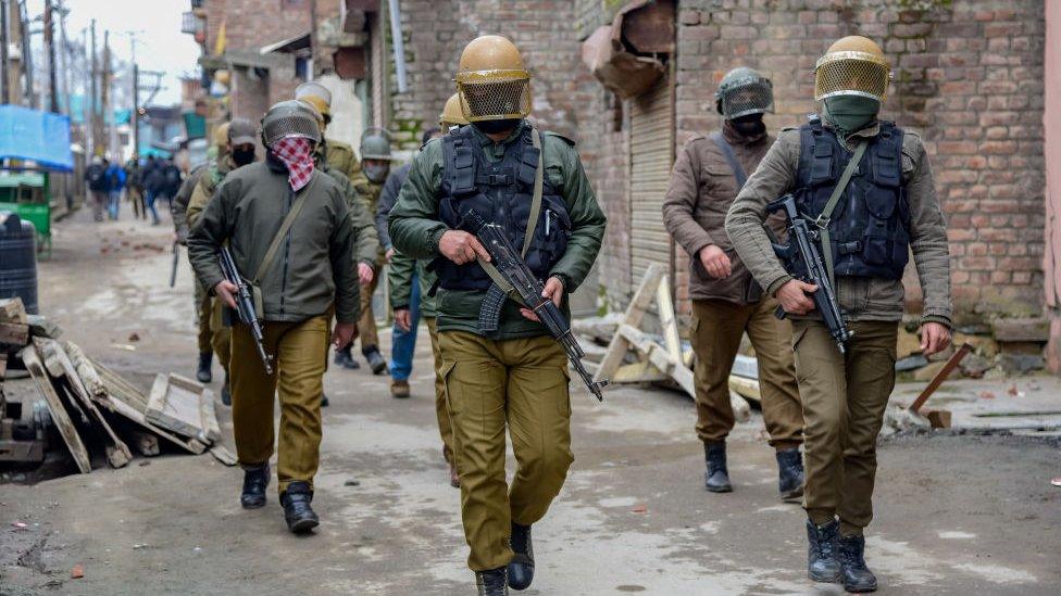 Indian policemen patrolling during clashes in Srinagar.