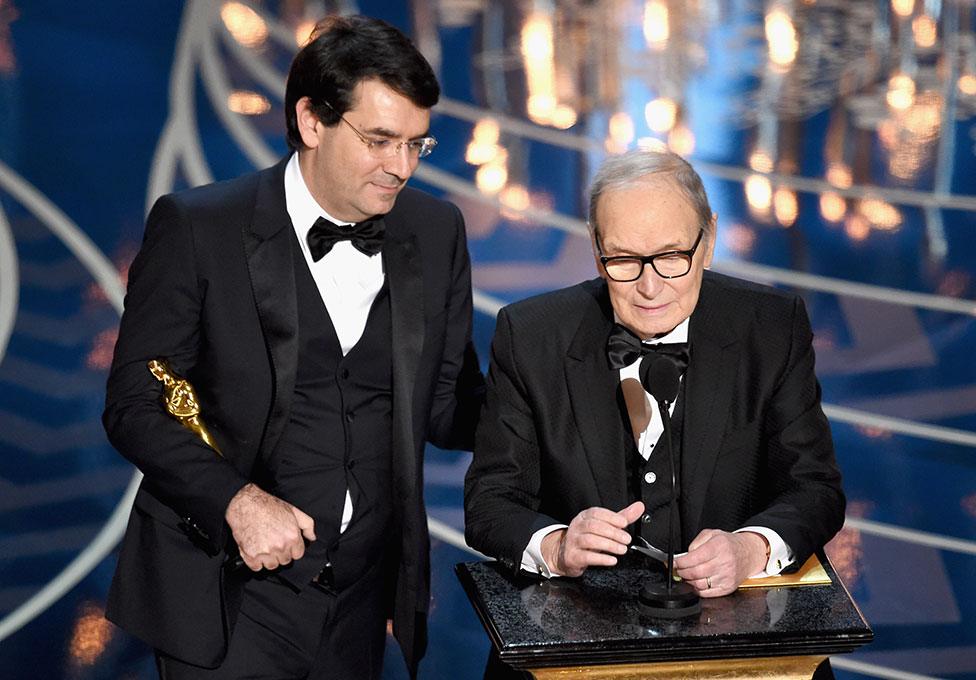 Ennio Morricone onstage with his Italian interpreter