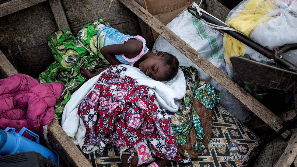 Girl sleeping in a boat