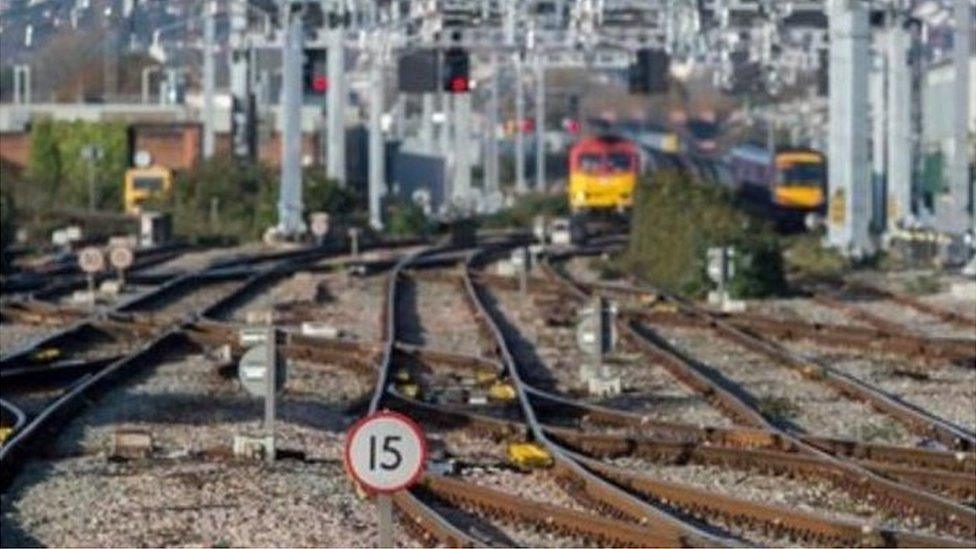 trains in the background on a rail network