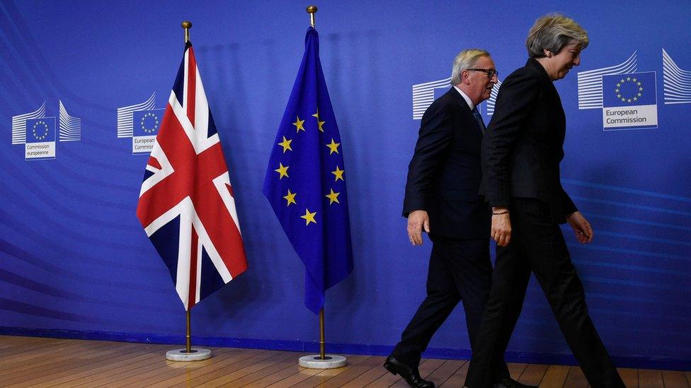 EU Commission President Jean-Claude Juncker and Prime Minister Theresa May