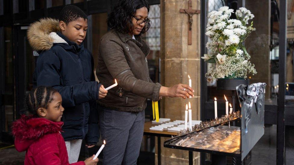 family-lighting-candle