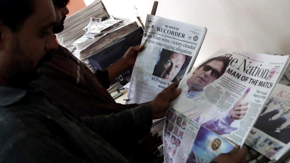 A man reads a Pakistani newspaper with a picture of Imran Khan, head of Pakistan Tehrik-e-Insaf (PTI) political party, on the front page a day after general elections in Karachi, Pakistan, 26 July 2018