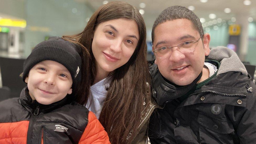 Nathan Rossiter, his wife Olena and son Leo arriving in England