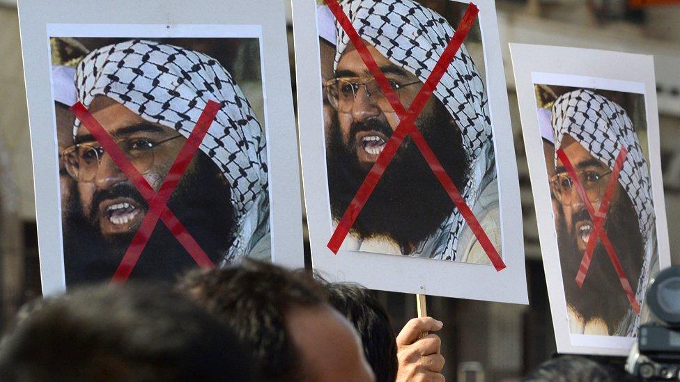 Indian activists carry placards of the chief of Jaish-e-Mohammad, Maulana Masood Azhar during a protest against the attack on the air force base in Pathankot, in Mumbai on January 4, 2016