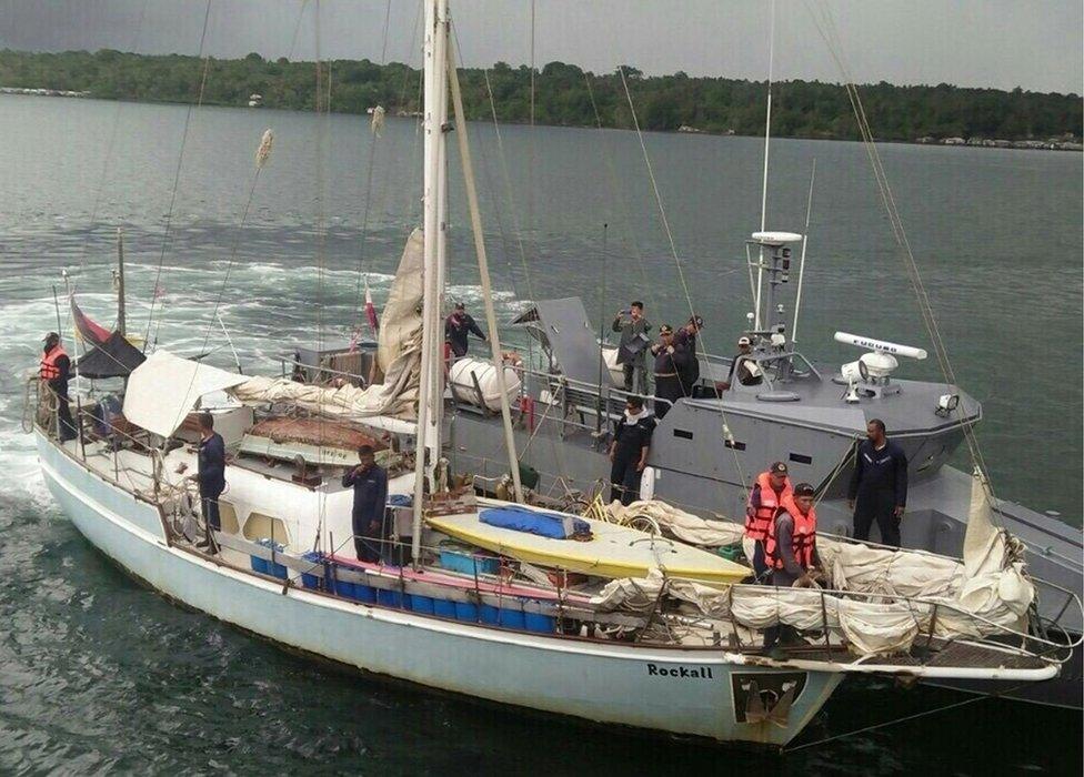 In this photo provided by the Armed Forces of the Philippines Western Mindanao Command (WESMINCOM) on 7 November 2016, Philippine Navy staff are seen boarding the yacht "Rockall" after being found abandoned off the Sulu Sea in southern Philippines.