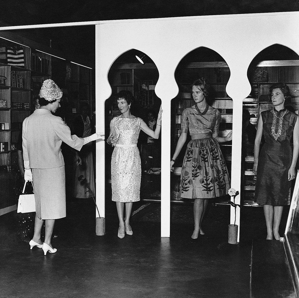 Queen Elizabeth II at a fashion show organized by the wives of diplomats in Delhi in 1961