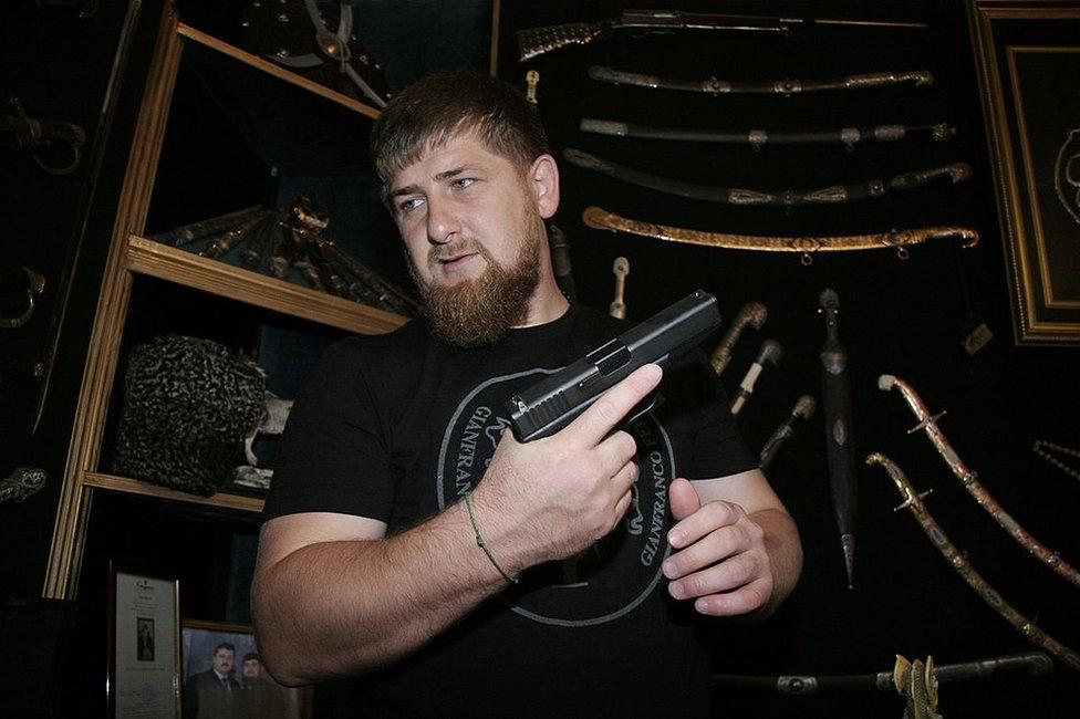 Ramzan Kadyrov with his collection of swords and guns