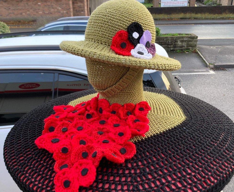 Alison's topper to mark remembrance featuring a soldier with a helmet on