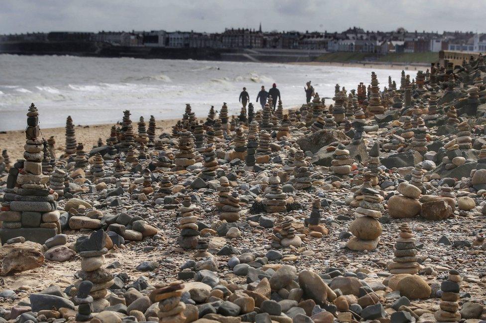 Pebble stacks on beach