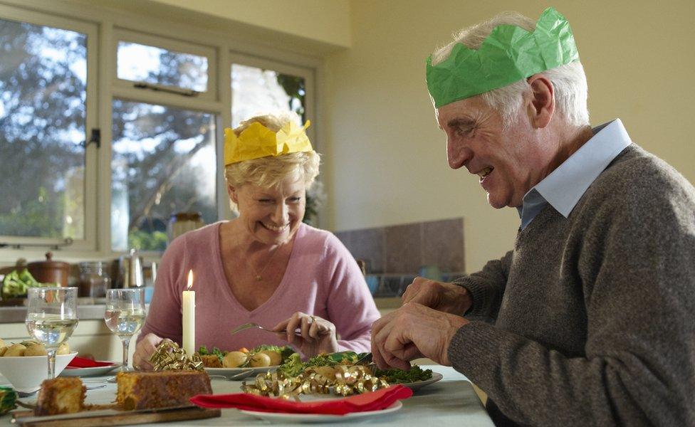 Older couple eating Christmas dinner