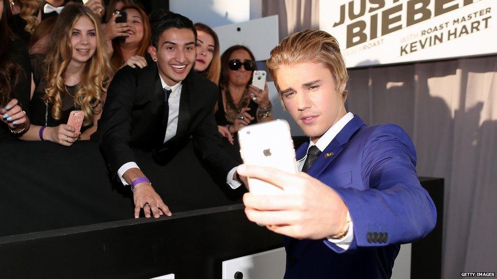 Justin Bieber taking pictures