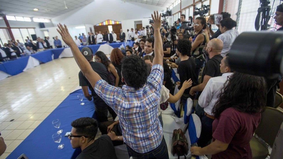 Students shout "They were students not criminals" during the start of the national talks in Managua, Nicaragua, 16 May 2018