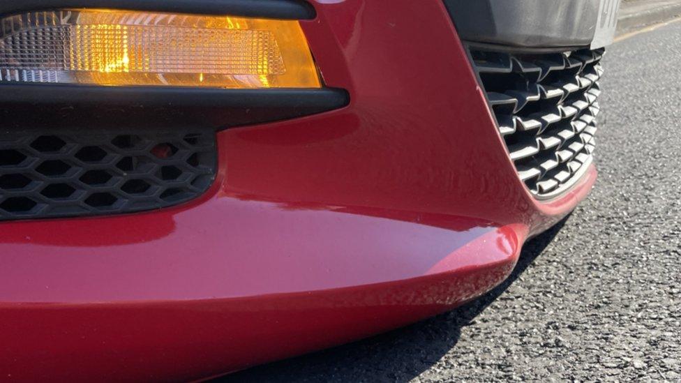 A car scraping on a road