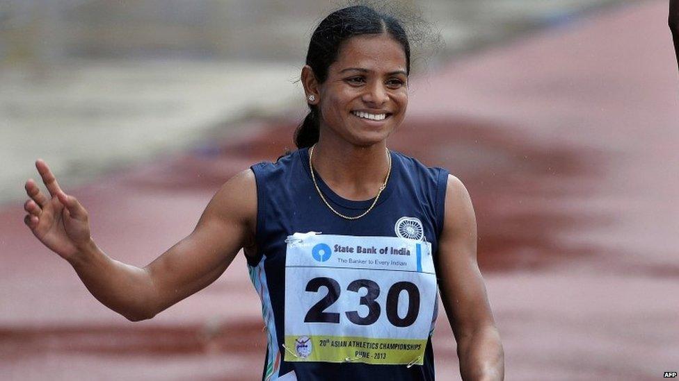 In this photograph taken on July 7, 2013, women"s 200 meters bronze medal winners from India, Dutee Chand waves to the crowd after the race on the fifth and the final day of the Asian Athletics Championship 2013 at the Chatrapati Shivaji Stadium in Pune.