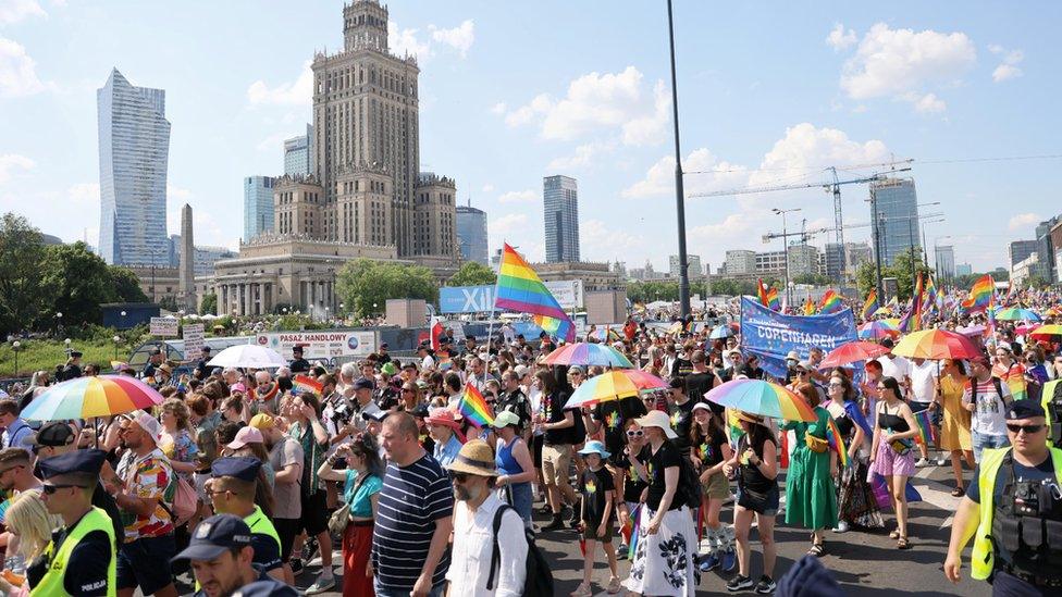 People participate in the Gay Pride parade in Warsaw, Poland