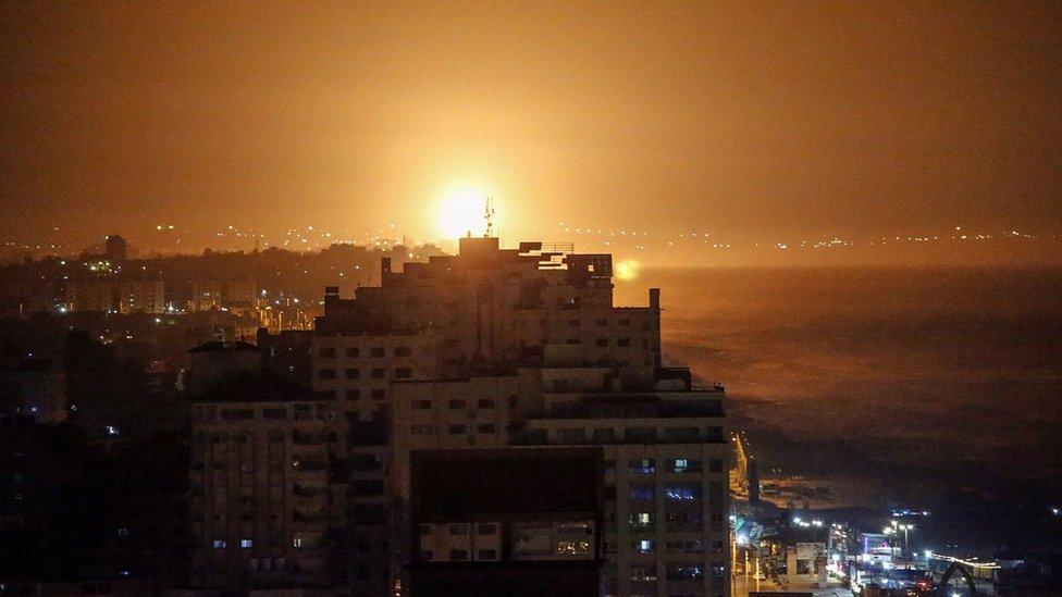 Smoke and flames rise following an Israeli air strike in the southern Gaza Strip (13 September 2021)