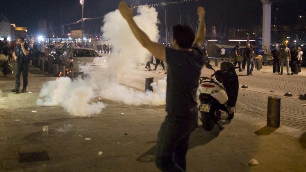 A man walking towards tear gas in France