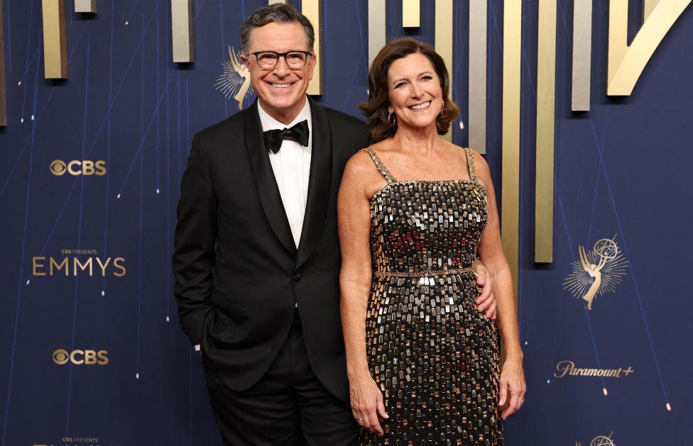 Stephen Colbert (L) and wife Evelyn McGee-Colbert arrive for the 77th Primetime Emmy Awards at the Peacock Theatre at LA Live in Los Angeles on September 14, 2025